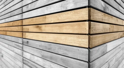 Corner view of a timber facade with horizontal slats.